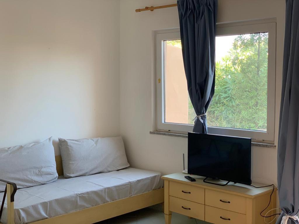 Postel nebo postele na pokoji v ubytování Residence Cala Rossa
