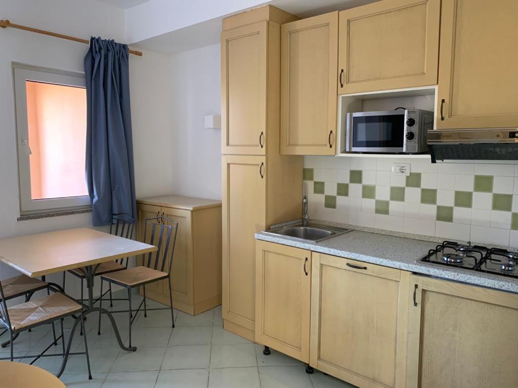 Kuchyň nebo kuchyňský kout v ubytování Residence Cala Rossa
