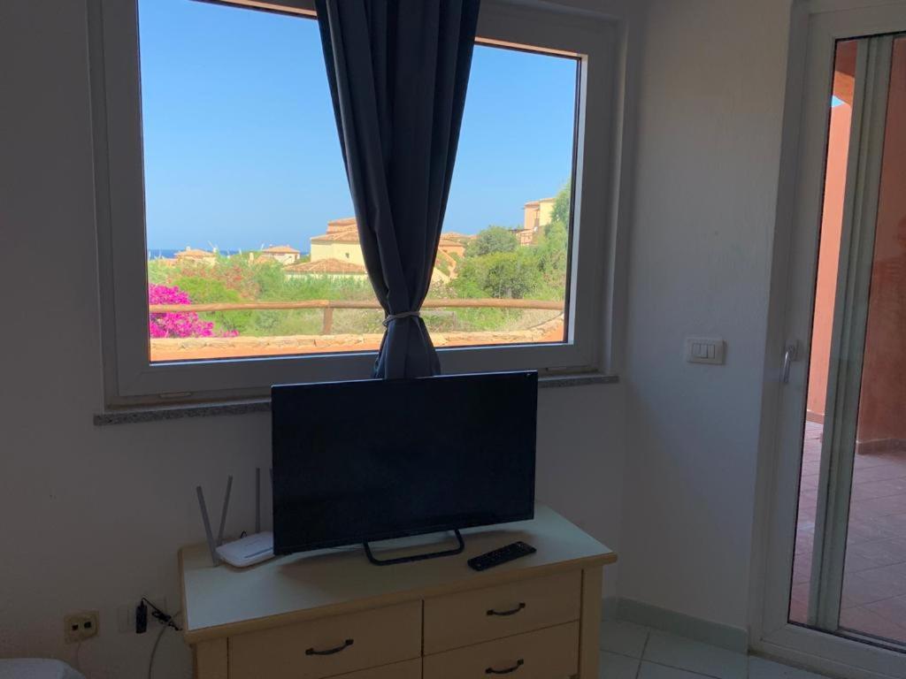 TV a/nebo společenská místnost v ubytování Residence Cala Rossa