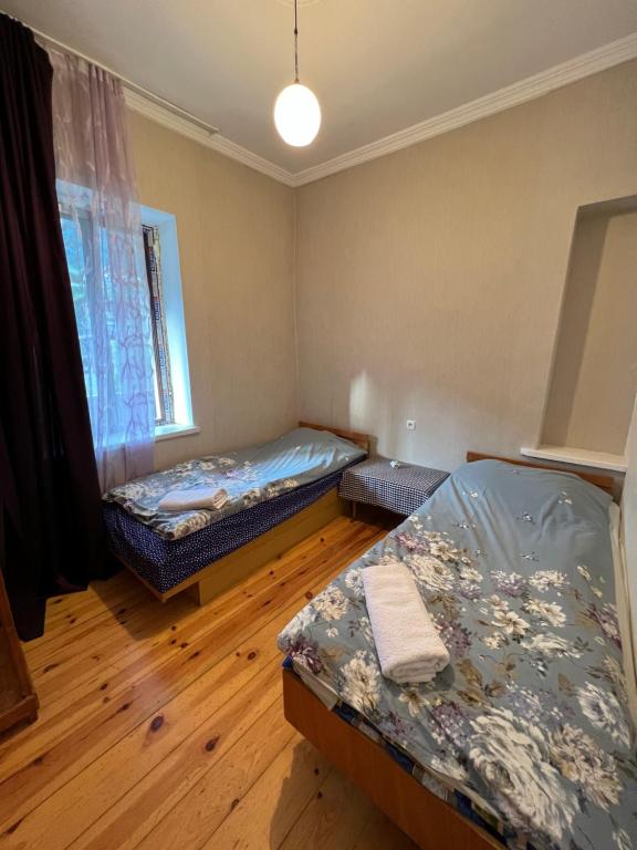 Postel nebo postele na pokoji v ubytování Mushkudiani Manor