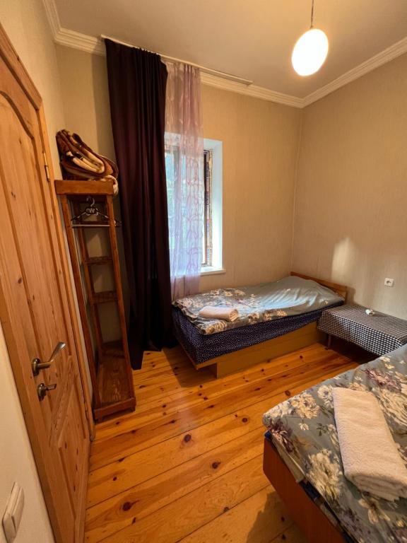 Postel nebo postele na pokoji v ubytování Mushkudiani Manor