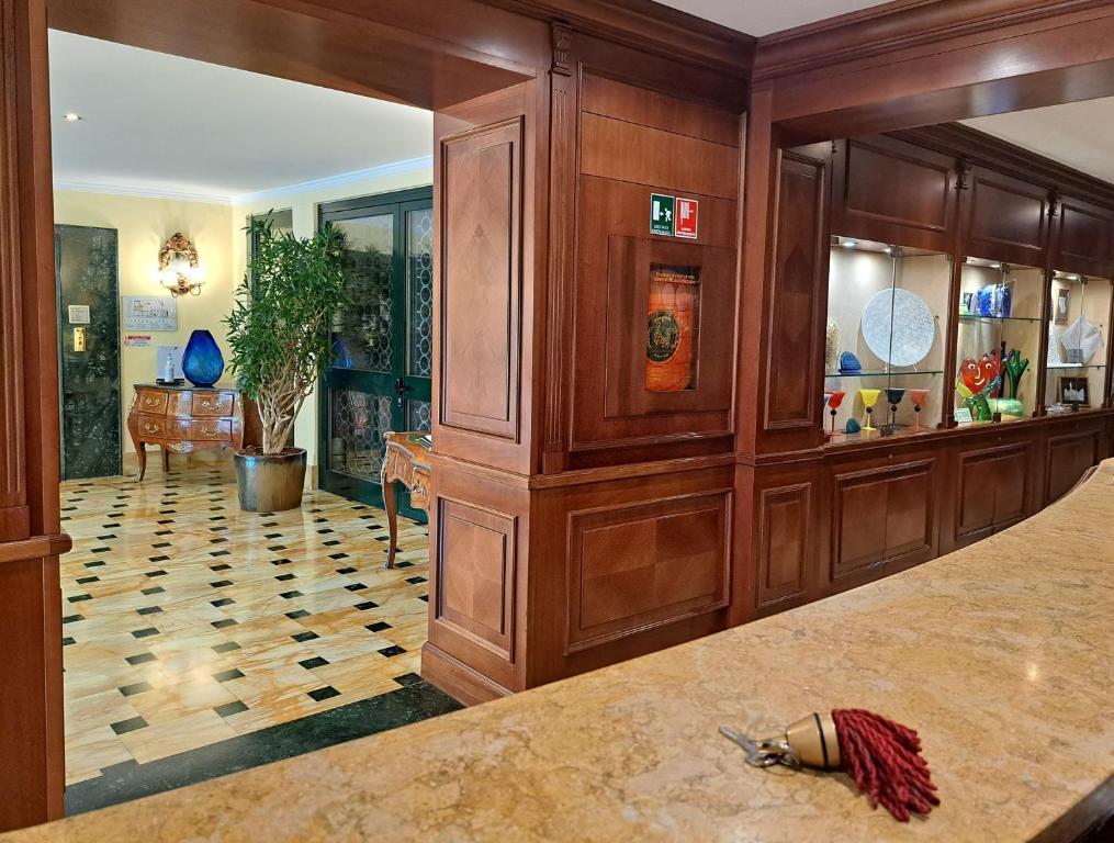 a large room with a large wooden wall at Sina Palazzo Sant'Angelo in Venice