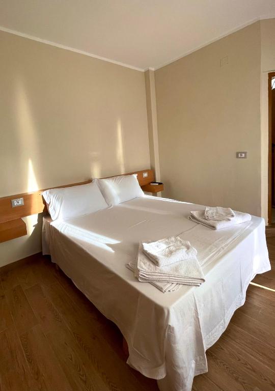 Postel nebo postele na pokoji v ubytování Tékada Hotel & Restaurant