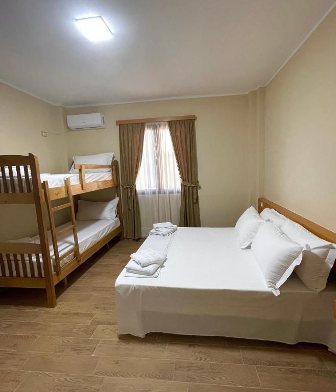 Postel nebo postele na pokoji v ubytování Tékada Hotel & Restaurant