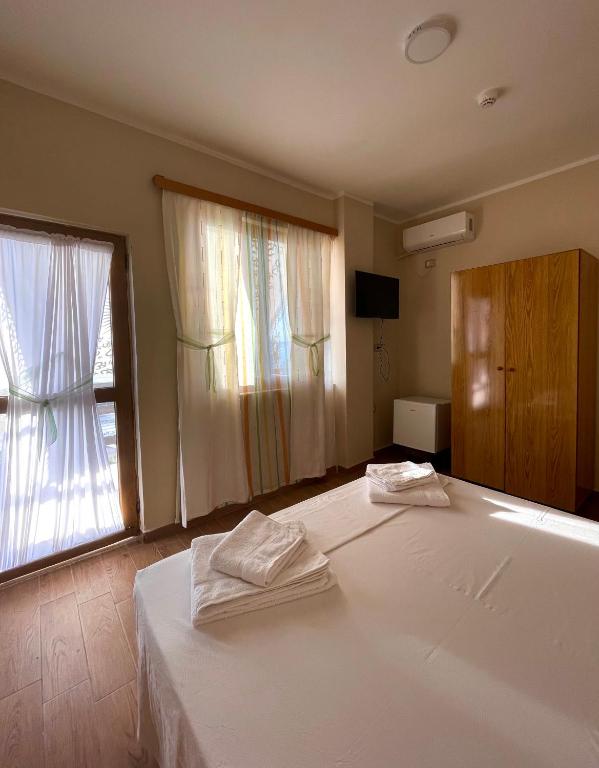 Postel nebo postele na pokoji v ubytování Tékada Hotel & Restaurant