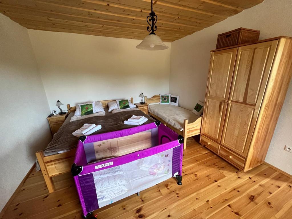 A bed or beds in a room at Chalupa v prírode