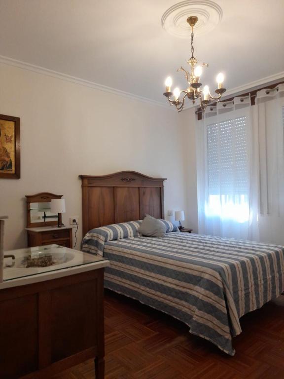 Postel nebo postele na pokoji v ubytování XOAN DE REQUEIXO