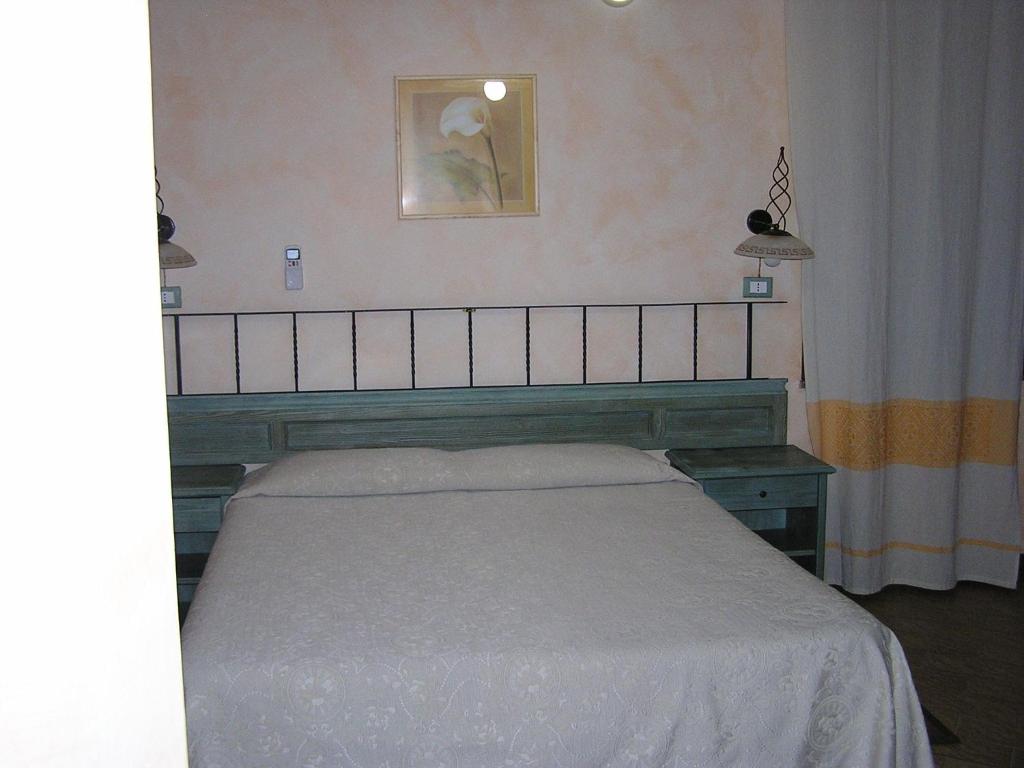 Postel nebo postele na pokoji v ubytování Hotel Mistral