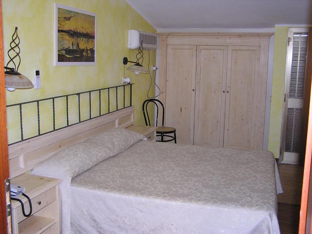 Postel nebo postele na pokoji v ubytování Hotel Mistral