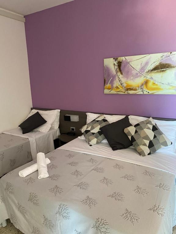 Postel nebo postele na pokoji v ubytování GFH - Hotel Spiaggia D'Oro