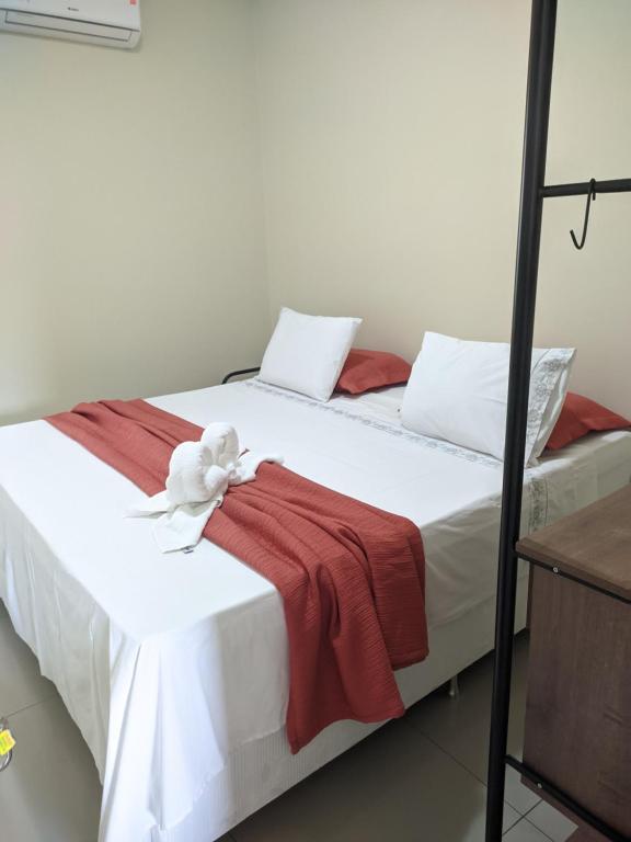 Ein Bett oder Betten in einem Zimmer der Unterkunft Apartamento da Cintia