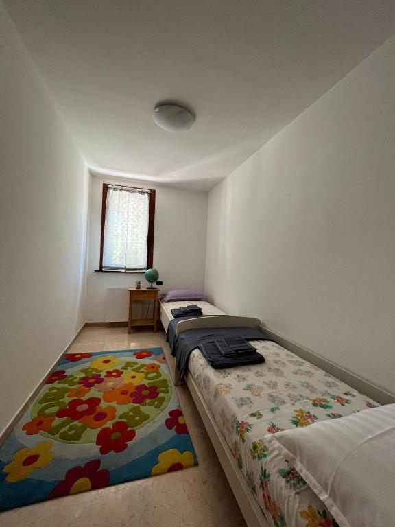 A bed or beds in a room at Orizzonte Marino Blu-vacanza ricca di colori