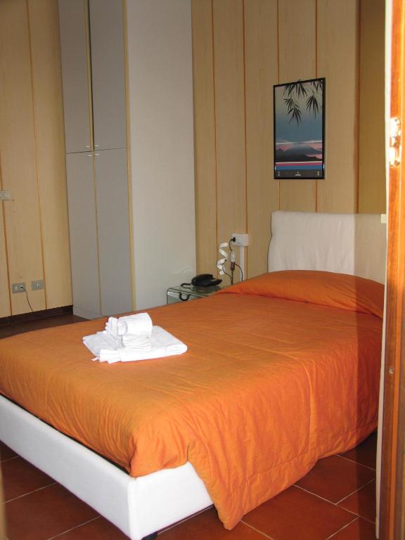 Postel nebo postele na pokoji v ubytování Albergo Residence Isotta