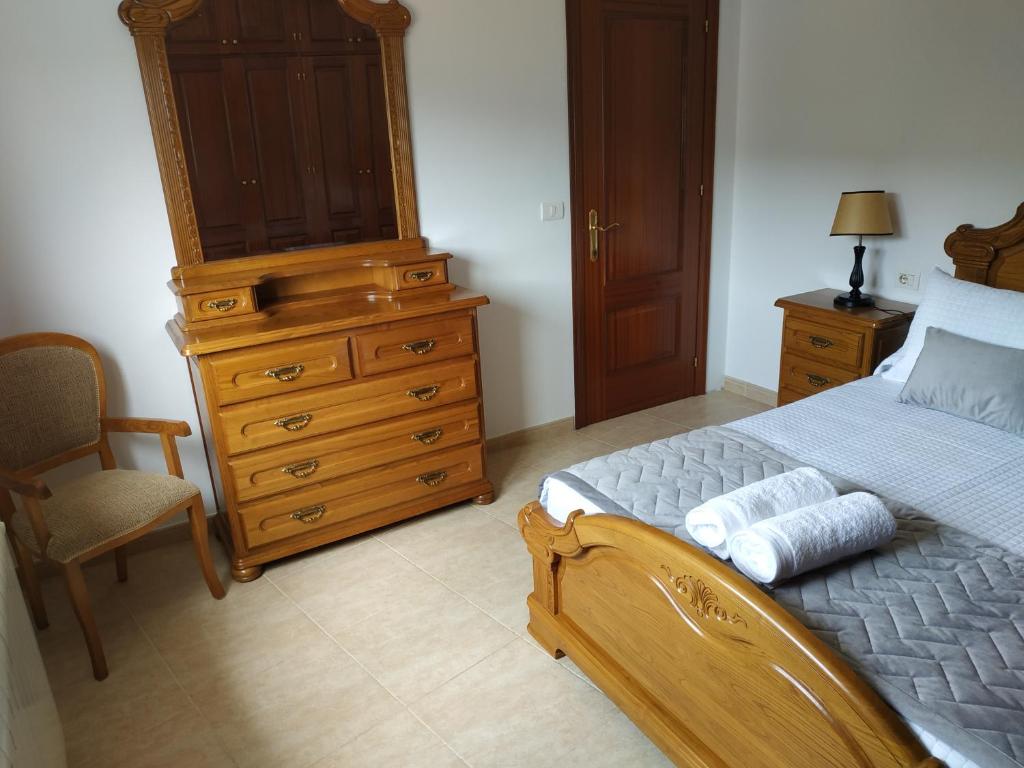 A bed or beds in a room at Casa Xarreiro