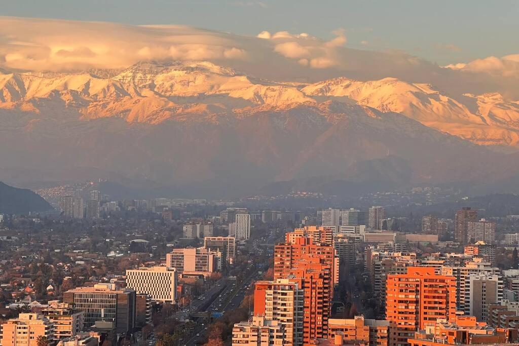 a view of a city with mountains in the background at Luxury apartment 37th floor en distrito de lujo in Santiago