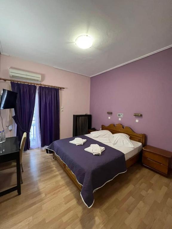 Postel nebo postele na pokoji v ubytování Hotel Korinthos