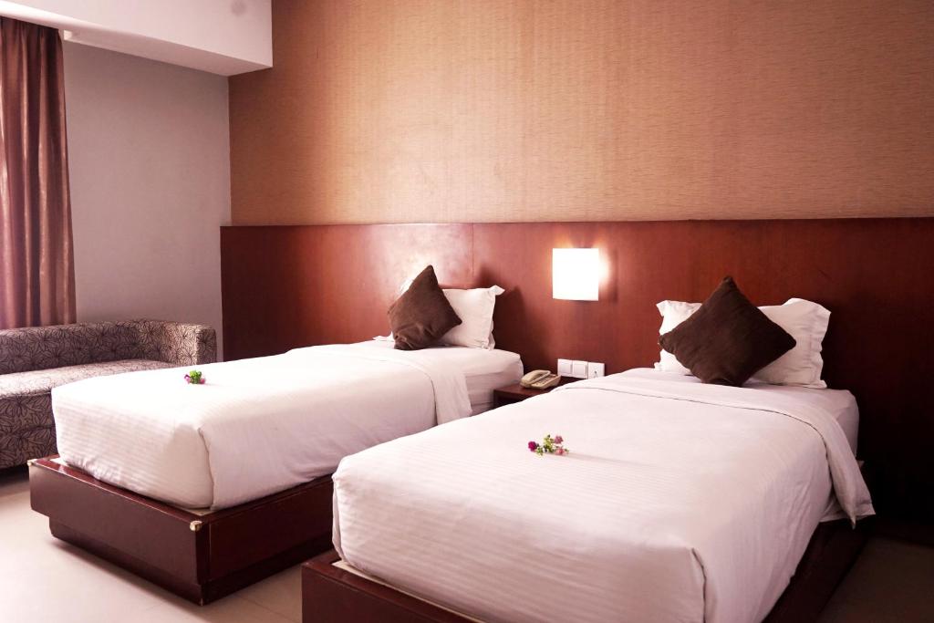 Postel nebo postele na pokoji v ubytování Grand Hatika Hotel