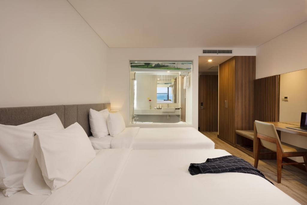Giường trong phòng chung tại Gosia Hotel