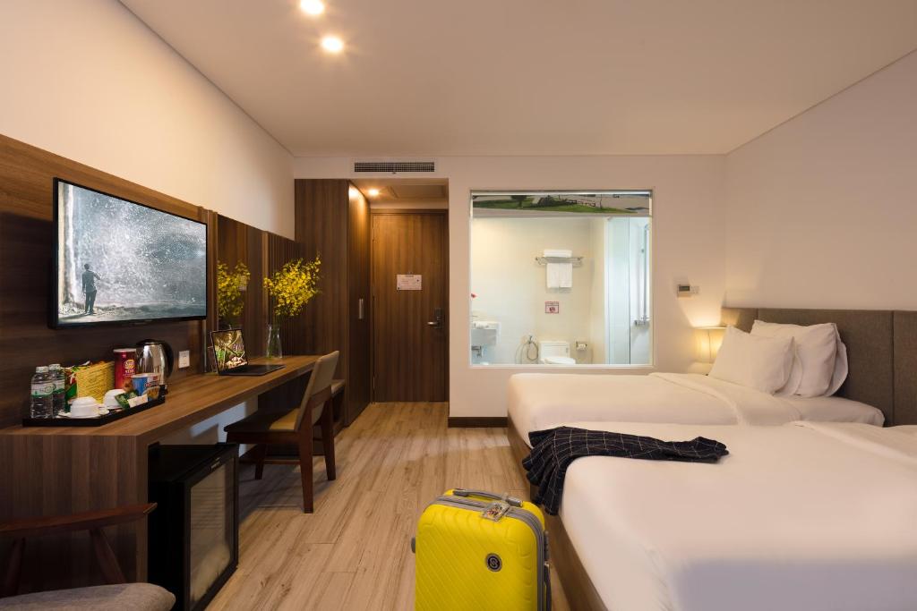 Giường trong phòng chung tại Gosia Hotel
