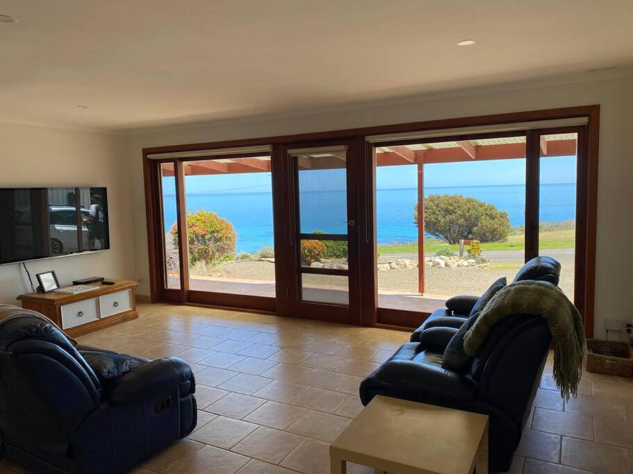 a living room with a view of the ocean at Kepals on the Coast - Kangaroo Island in Penneshaw