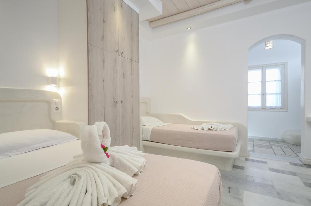 Posteľ alebo postele v izbe v ubytovaní Ostria Hotel