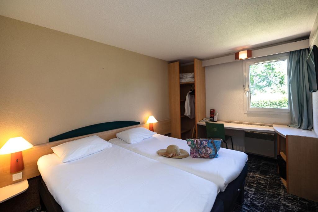 Postel nebo postele na pokoji v ubytování Hotel ibis Autun