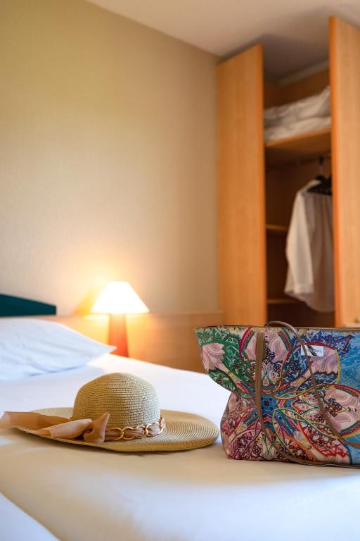 Postel nebo postele na pokoji v ubytování Hotel ibis Autun