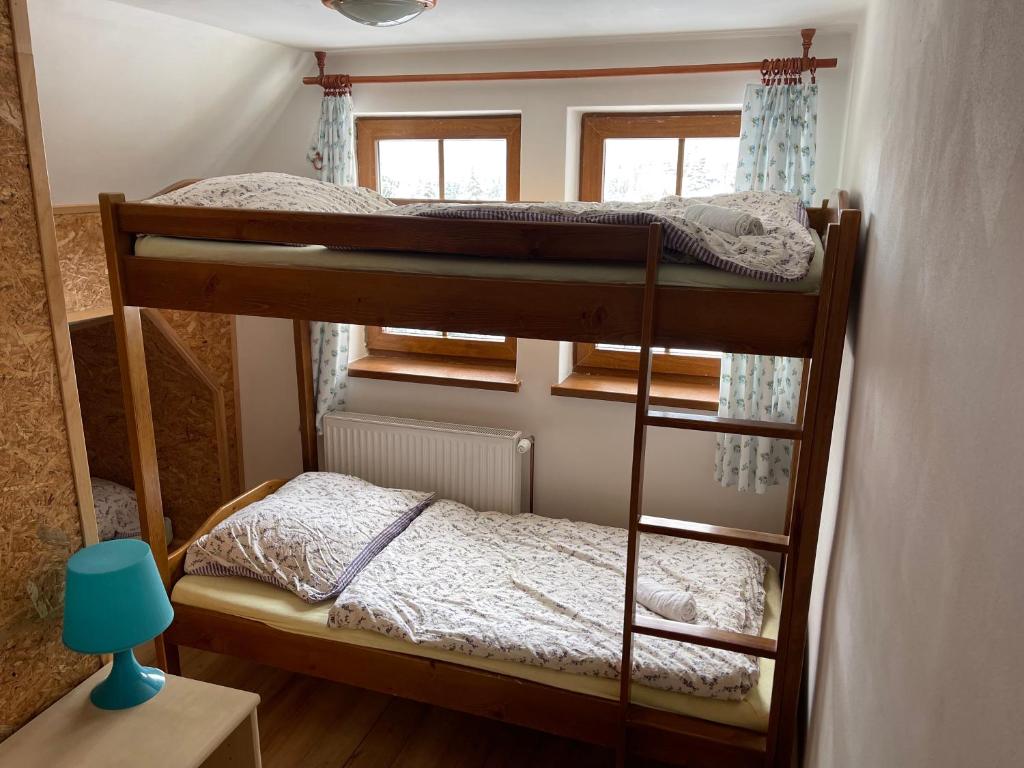 Postel nebo postele na pokoji v ubytování Hepnarova Bouda