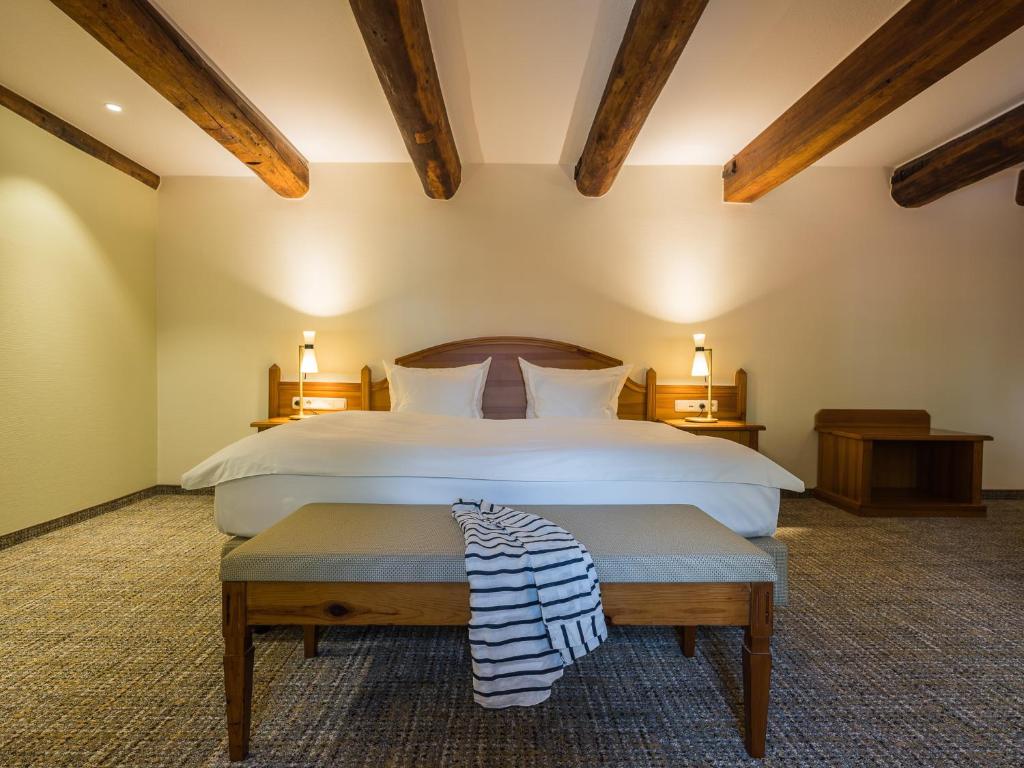 Postel nebo postele na pokoji v ubytování Romantik Hotel Reichshof