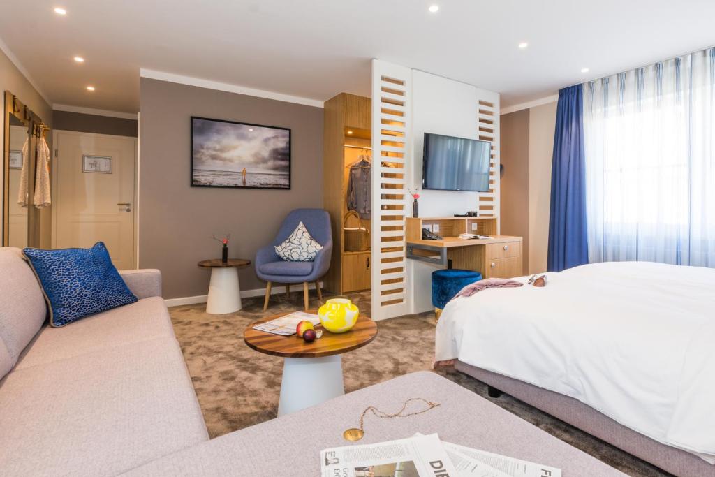 Postel nebo postele na pokoji v ubytování Romantik Hotel Reichshof