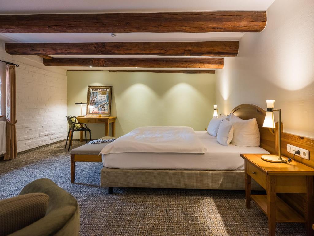 Postel nebo postele na pokoji v ubytování Romantik Hotel Reichshof