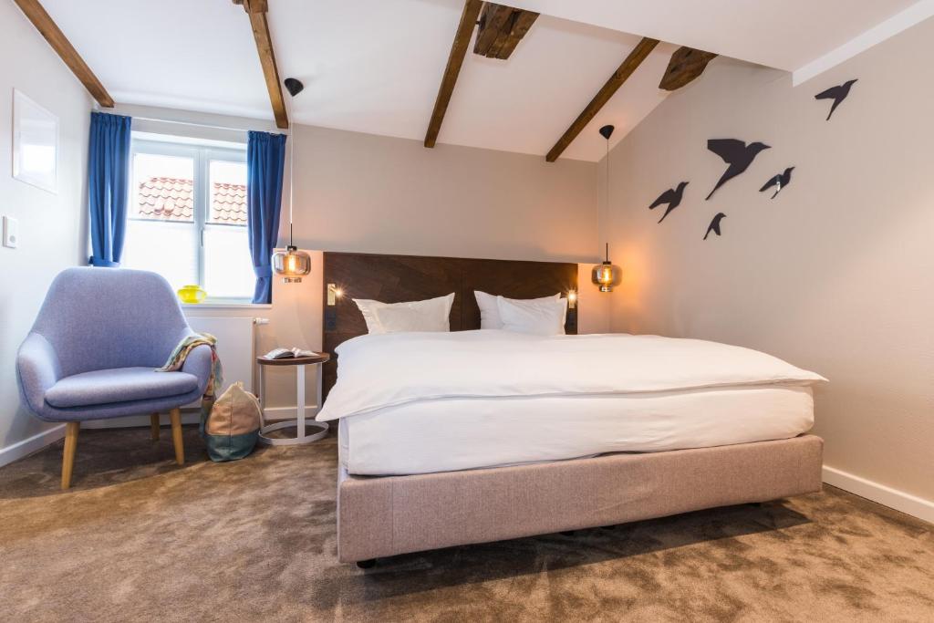 Postel nebo postele na pokoji v ubytování Romantik Hotel Reichshof