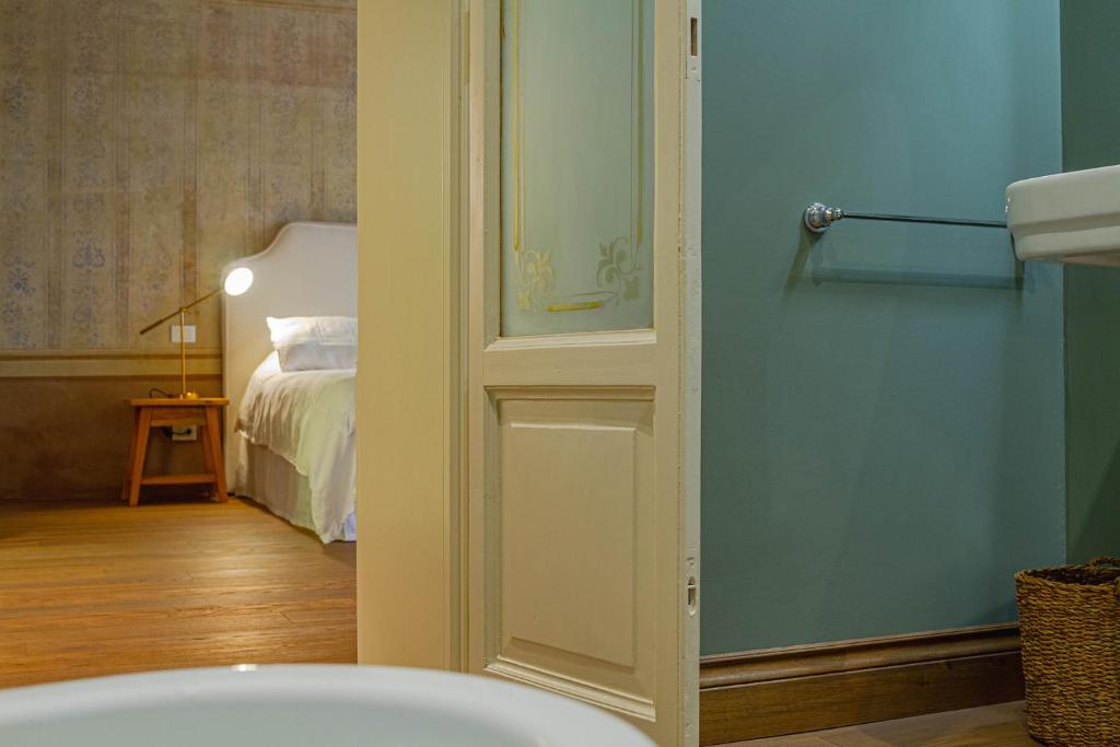 Posteľ alebo postele v izbe v ubytovaní Palazzo Glori 6