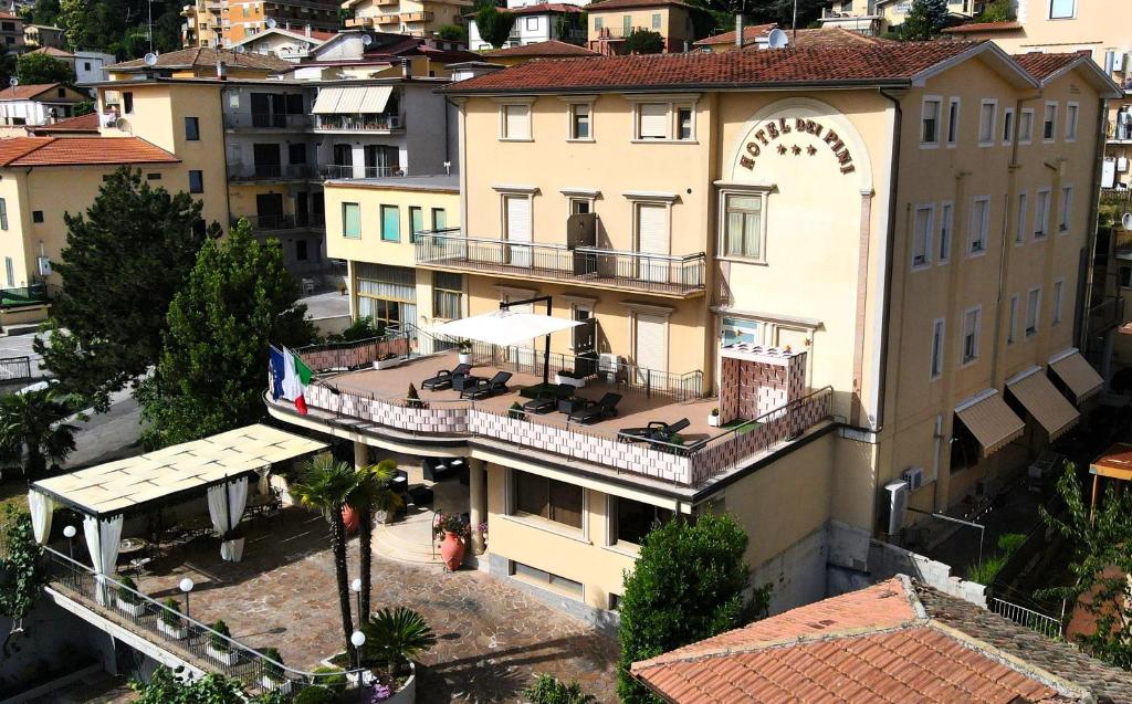 an aerial view of a building with chairs on a balcony at Hotel Dei Pini in Fiuggi