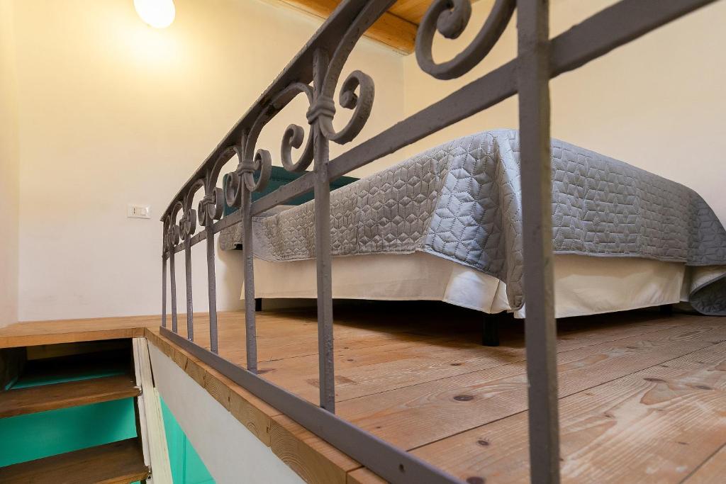 Łóżko lub łóżka w pokoju w obiekcie Casa del Pescatore