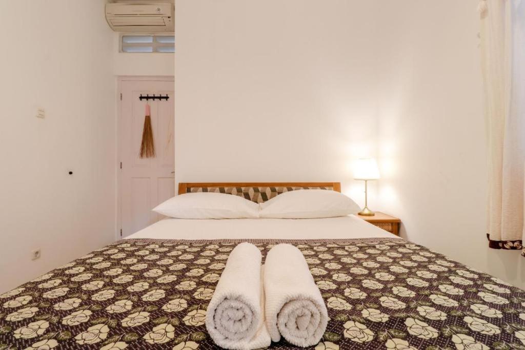 Postel nebo postele na pokoji v ubytování Palem Kipas Homestay