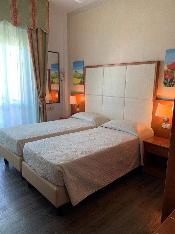 Postel nebo postele na pokoji v ubytování Hotel Apollo