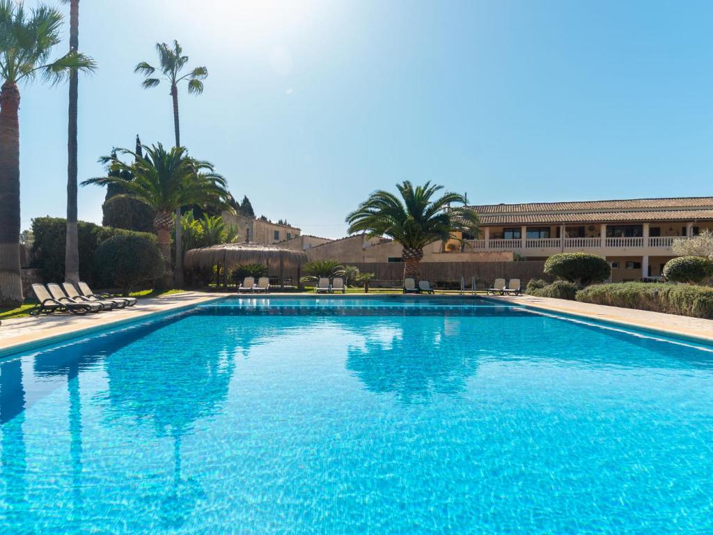 The swimming pool at or close to Apartment Finca Can Corritx-1 by Interhome