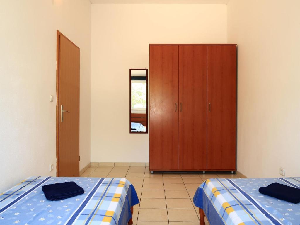 Postel nebo postele na pokoji v ubytování Apartment Andrea-1 by Interhome