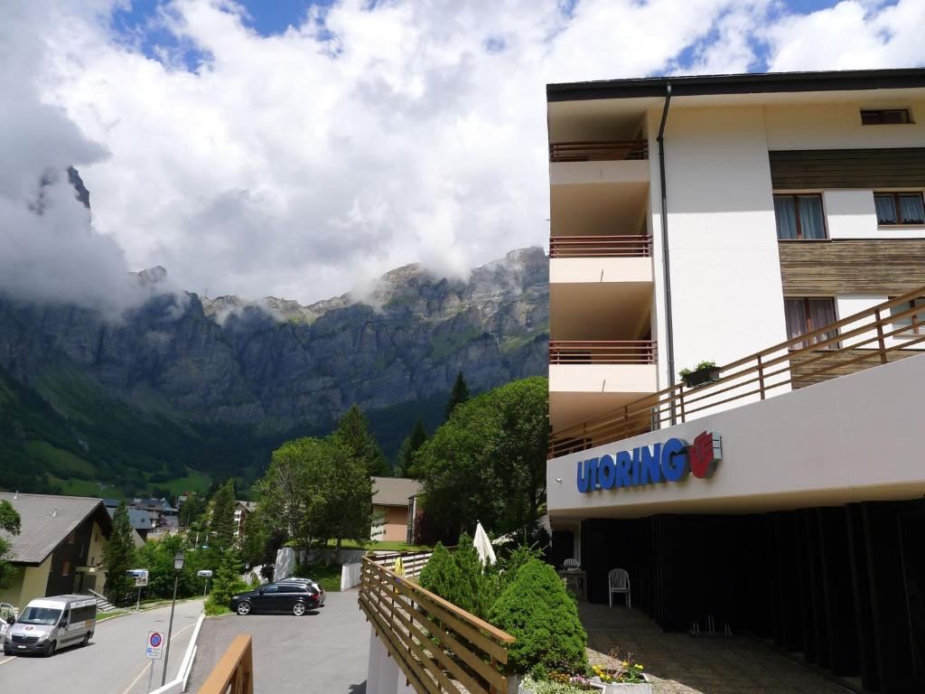 a building with a view of a mountain at Apartment Ringstrasse Apt 212 by Interhome in Leukerbad