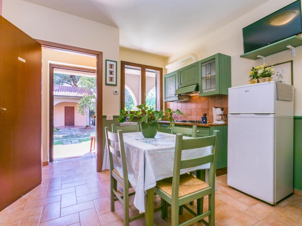 A kitchen or kitchenette at Holiday Home Bilocale - Ranch Hotel by Interhome