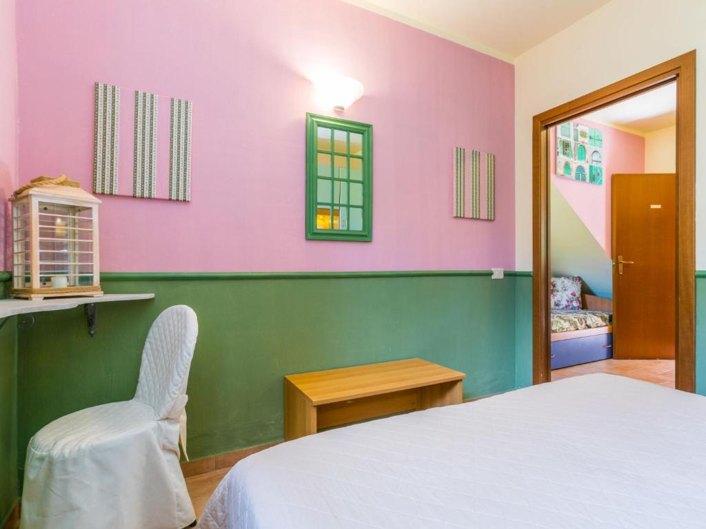 A bed or beds in a room at Holiday Home Bilocale - Ranch Hotel by Interhome