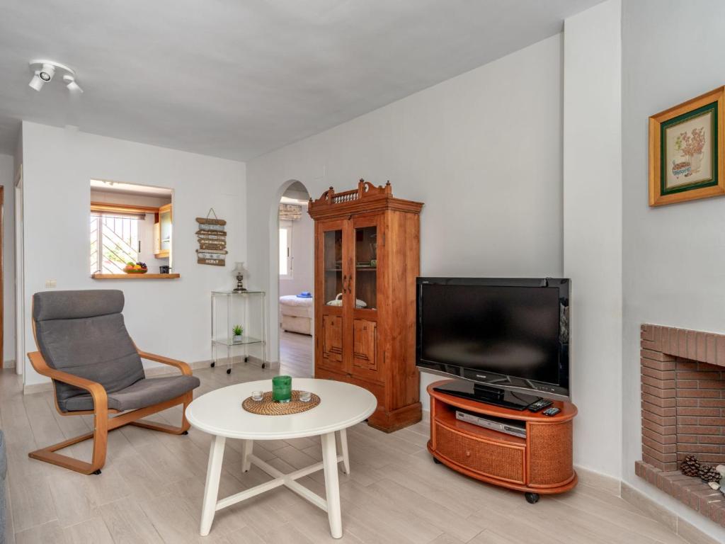 Telewizja i/lub zestaw kina domowego w obiekcie Apartment Calahonda Royale by Interhome