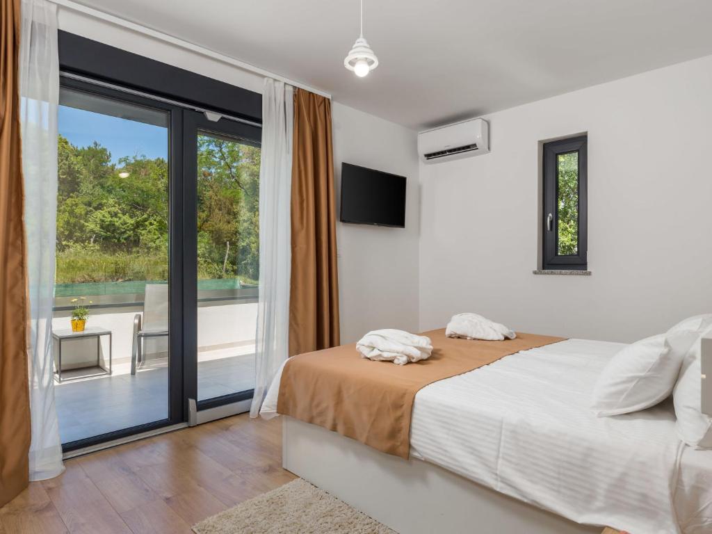 Postel nebo postele na pokoji v ubytování Villa Pinnidae by Interhome