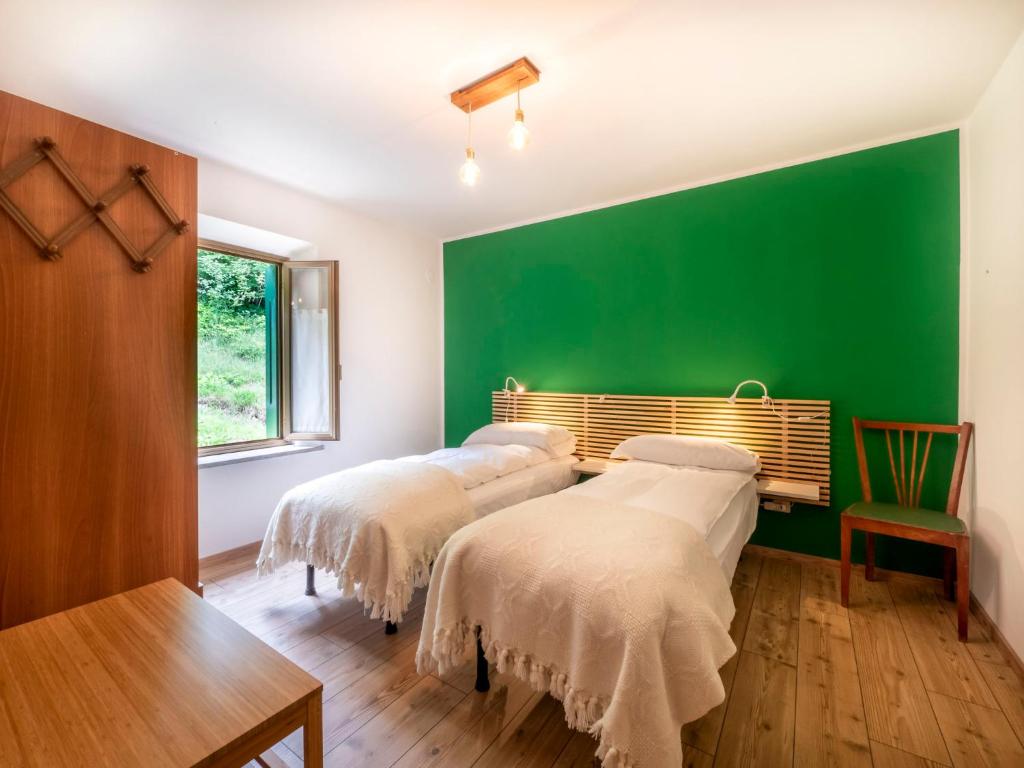 Postel nebo postele na pokoji v ubytování Holiday Home La Predaia by Interhome