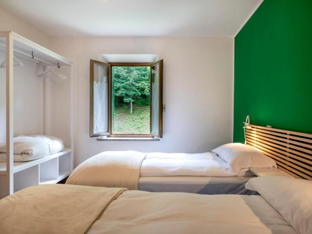 Postel nebo postele na pokoji v ubytování Holiday Home La Predaia by Interhome