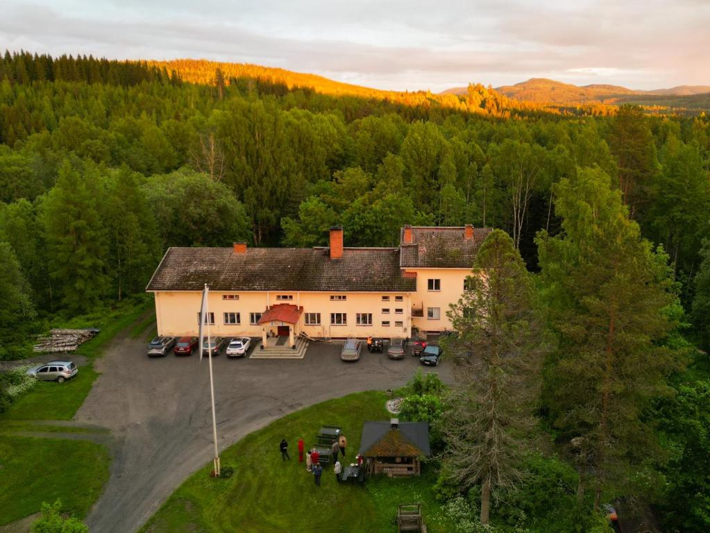 an aerial view of a house with a parking lot at Vanhan Koulun Majatalo-Old School Guest House in Kolinkylä