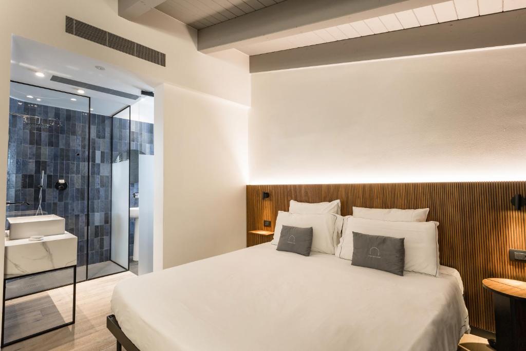 Postel nebo postele na pokoji v ubytování Hotel Casa Scaligeri