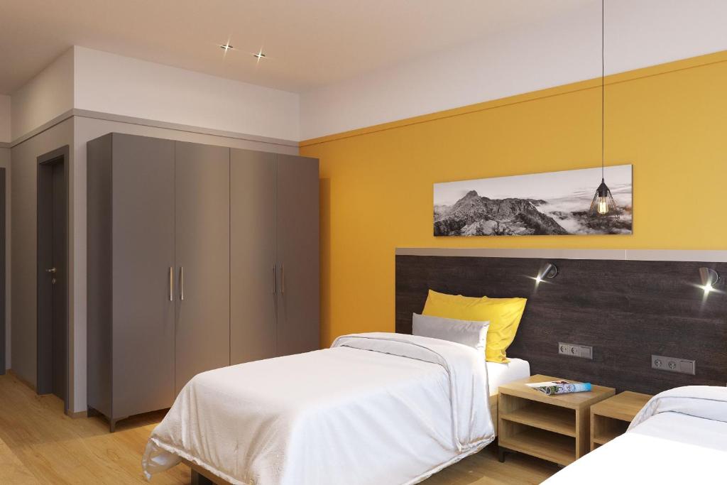 Postel nebo postele na pokoji v ubytování TANKER Apartments & Bistro Čaradice