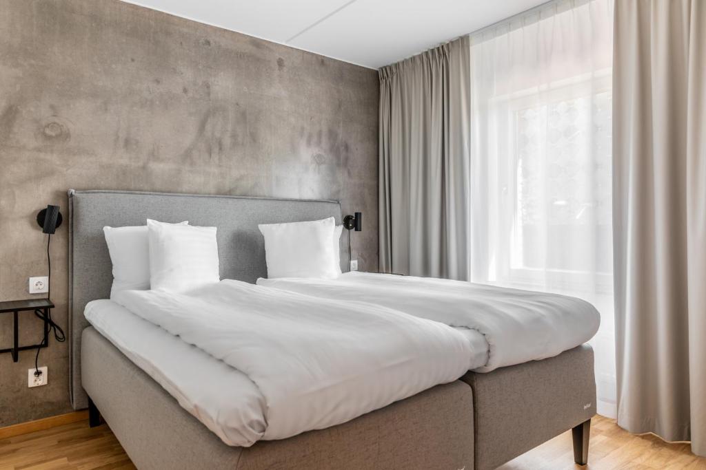 Postel nebo postele na pokoji v ubytování The More Hotel Västra Hamnen